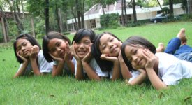 Asia Children on Lawn Between English Lessons Photo