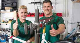 Bicycle Mechanics Working in Bike Shop Photo Button