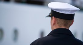 Sailer Looking at Ship Photo