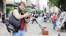 Travel Photographer Poses for a Shot Photo