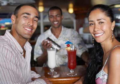 Bartender on Cruise Ship Mixing Cocktails for Passengers Photo