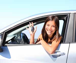 Female Ridesharing Driver Smiles for Camera