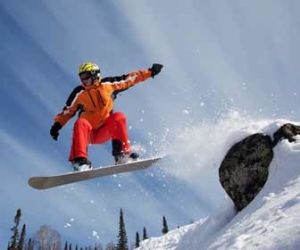 Snowboarder In The Air With Blue Sky Picture