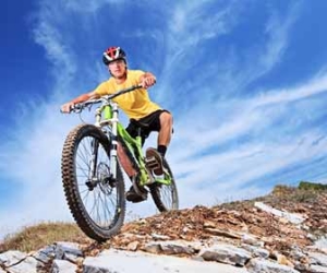 Mountain Biker Riding A Rocky Trail Picture