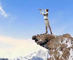 Woman With Telescope On Rocky Outcrop Picture