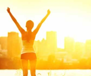 Woman Stretching And Exercising In Evening Sun