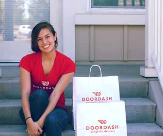 DoorDash Worker Sits on Steps for Photo