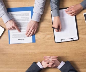 Job Candidate Seated Across From Two Job Interviewers