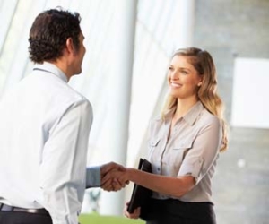 Man and woman shaking hands after meeting for first time picture