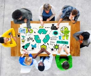 Eco-friendly concept at table of workers from above