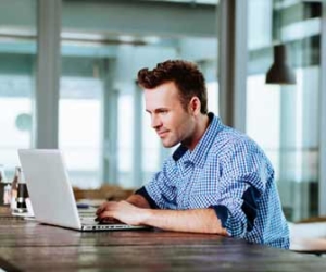 Remoter worker at laptop working from home