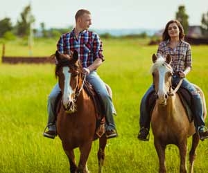 Guest Ranch Employees Riding Horses