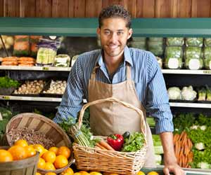 Cook at Grocery Store Poses for Pictures