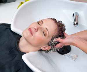 Woman Getting Hair Washed at Hair Salon