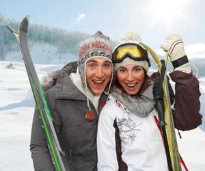 Ski Resort Employees Pose for Picture with Their Skis