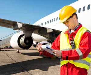 Airline Engineer Inspecting a Commercial Airplane