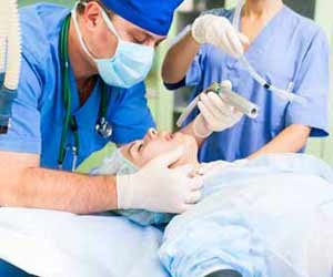 Anethesiologist Working on Patient at Hospital