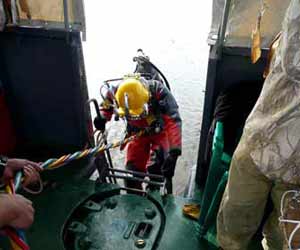 Commercial Diver Entering the Water for a Dive Photo