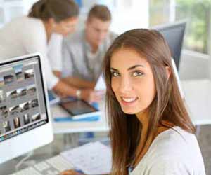 Female Intern Working on Computer