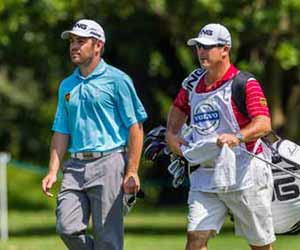 Golf Caddy walking with Pro Golfer