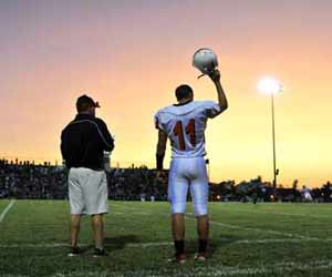 High School Football Coach with Player