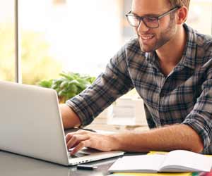 Sports Journalist on laptop getting things done