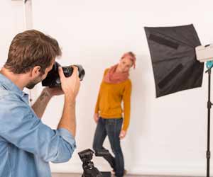 Fashion Photographer doing Photo Shoot with Female Model