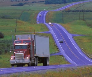 Big rig truck driving down the open road