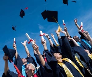 Group of students celebrating college graduation