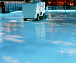 Zamboni Driver Prepares Ice for Hockey Game