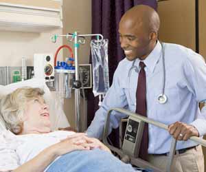 Doctor Checks Up on Patient in Hospital