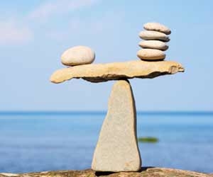 Rocks balancing on other rocks in front of the ocean