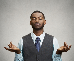 A professional in tie and vest finding a moment of peace and quiet