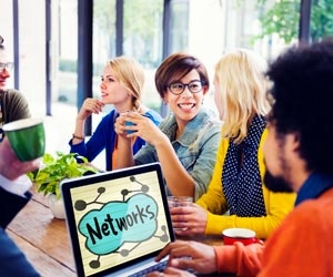 Group of young professionals networking in a coffee shop