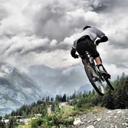 Mountain Bike Patrollers Ride Their Bikes Along Trails to Make Sure they are Safe