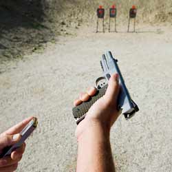 A Range Master Instructs People How to Safely Operate Various Firearms on a Gun Range