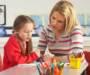 Nanny Helping Young Girl do Homework Photo